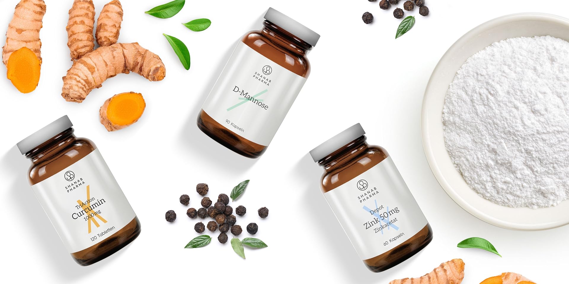 Verschiedene Produkte der Marke Shanab Pharma neben verschiedenen Kräutern